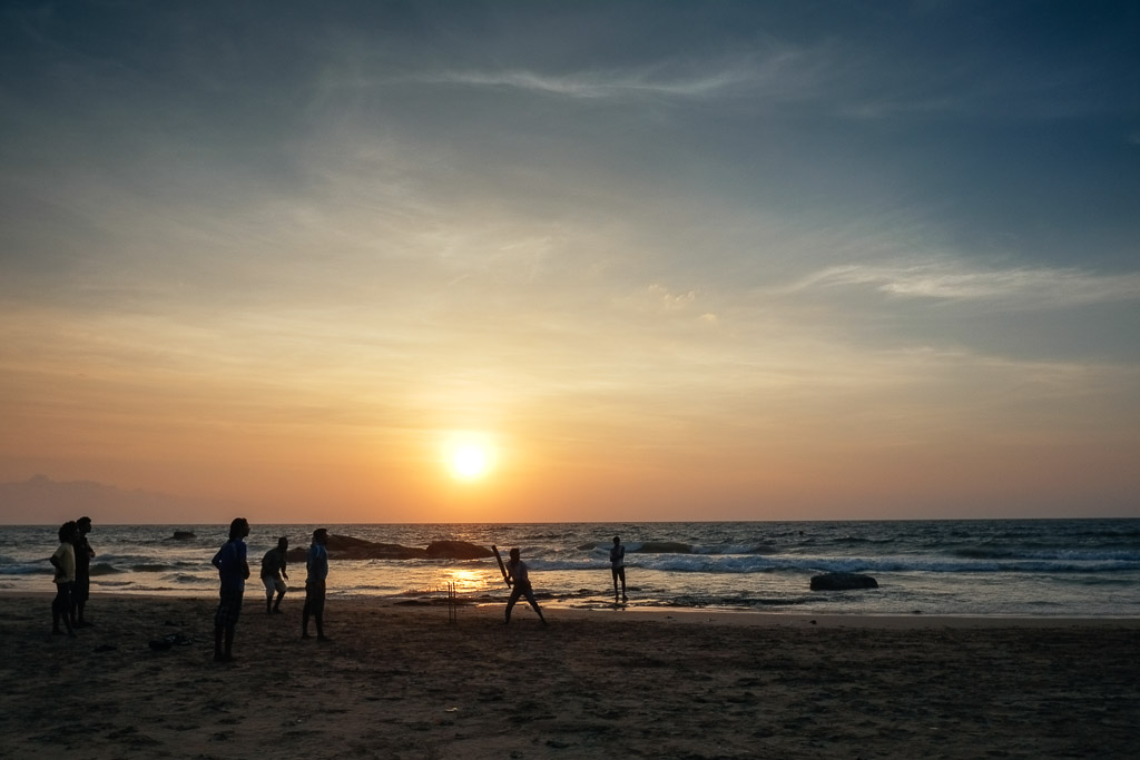 Beach cricket at sunset, Mount Lavinia, Sri Lanka.