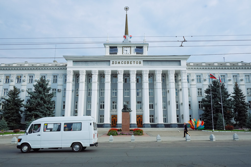 Transnistria, downtown Tiraspol. Lenin statue in front of Soviet style architecture.